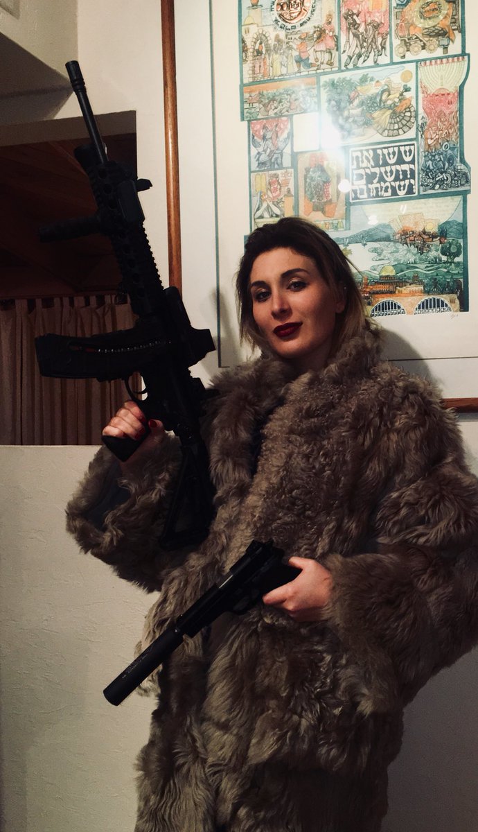 laura-loomer-with-guns-5a4a8f00eb2d4.jpeg